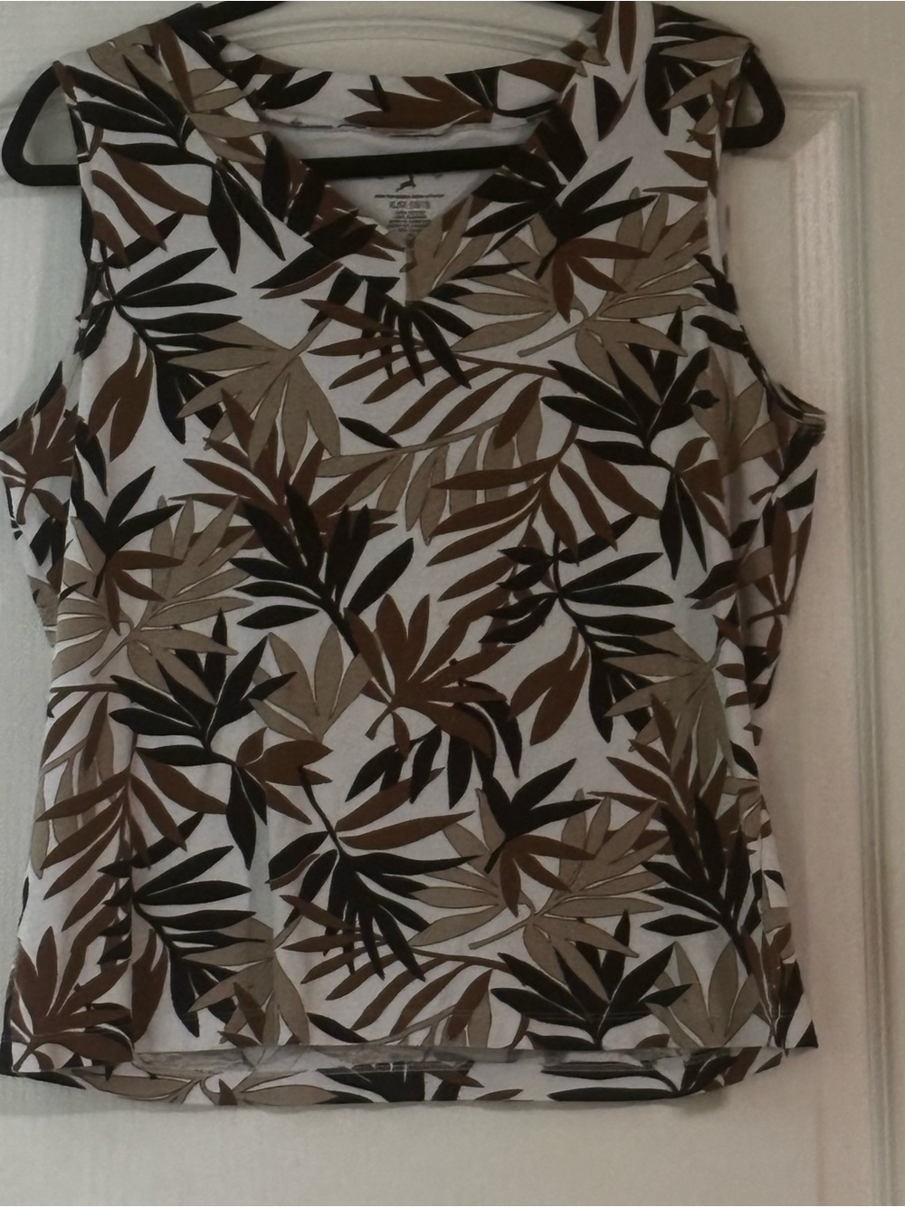 Sleeveless Leaf-Print Women's Top in White, Brown, & Black.